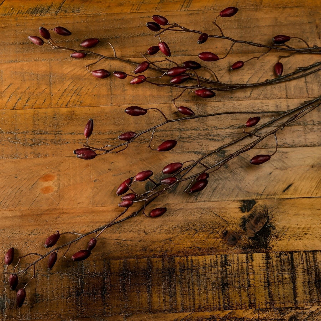 Artificial Burgundy Rosehip Stem, included in The Darcy Antique White Christmas Arrangement