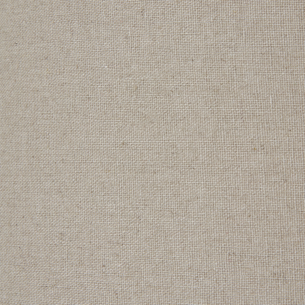 Squat White Beaded Ceramic Lamp With Linen Shade styled on a bedside
