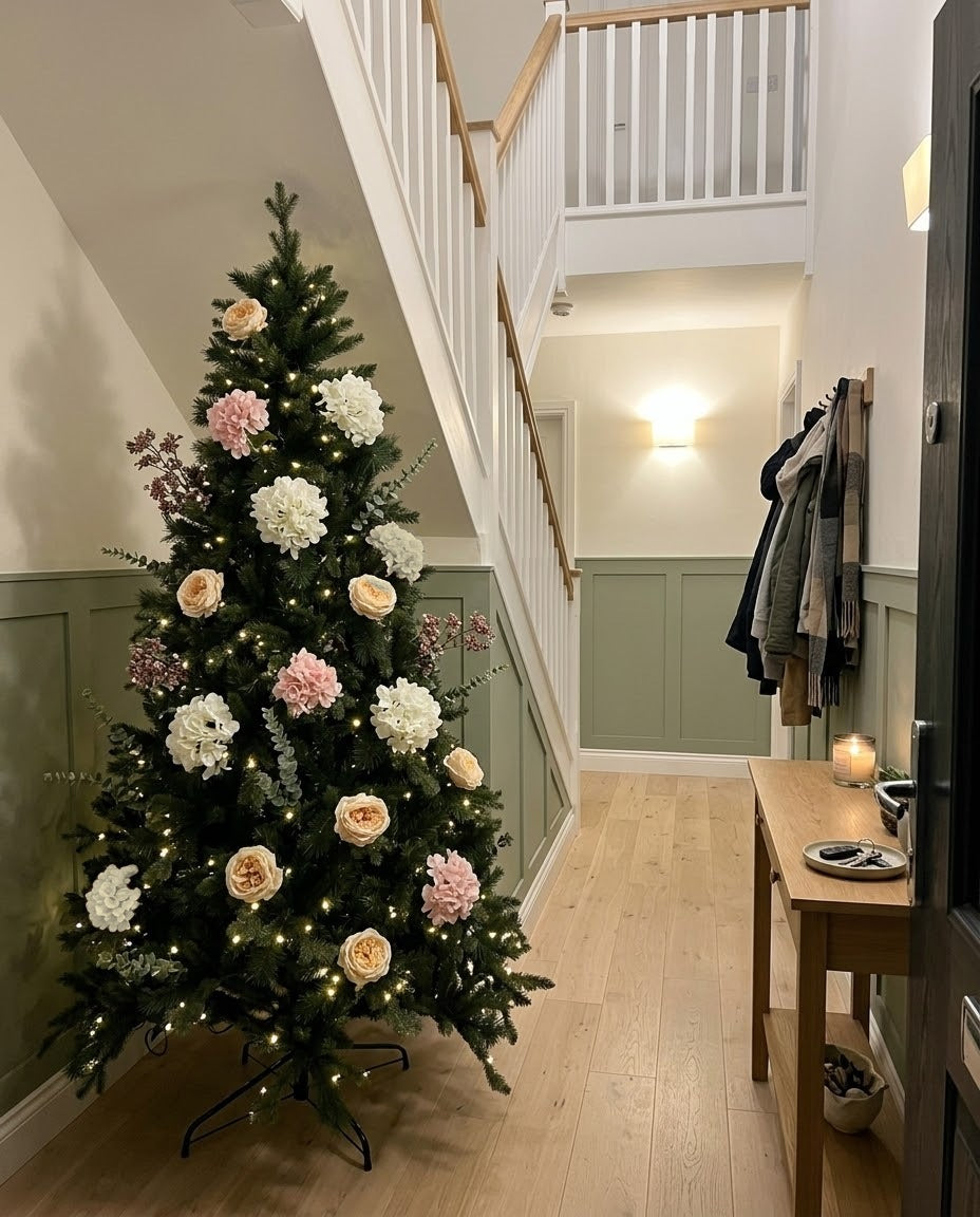 The artificial Winter Bloom Flower Christmas Tree in a panelled hallway beside the stairs