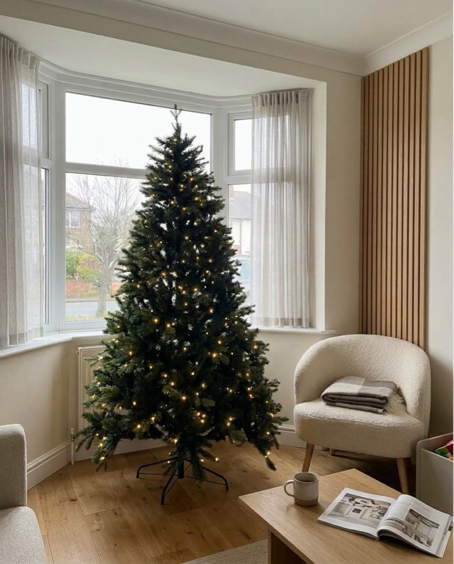7ft pre-lit Forest Fir artificial Christmas tree in a bright bay window