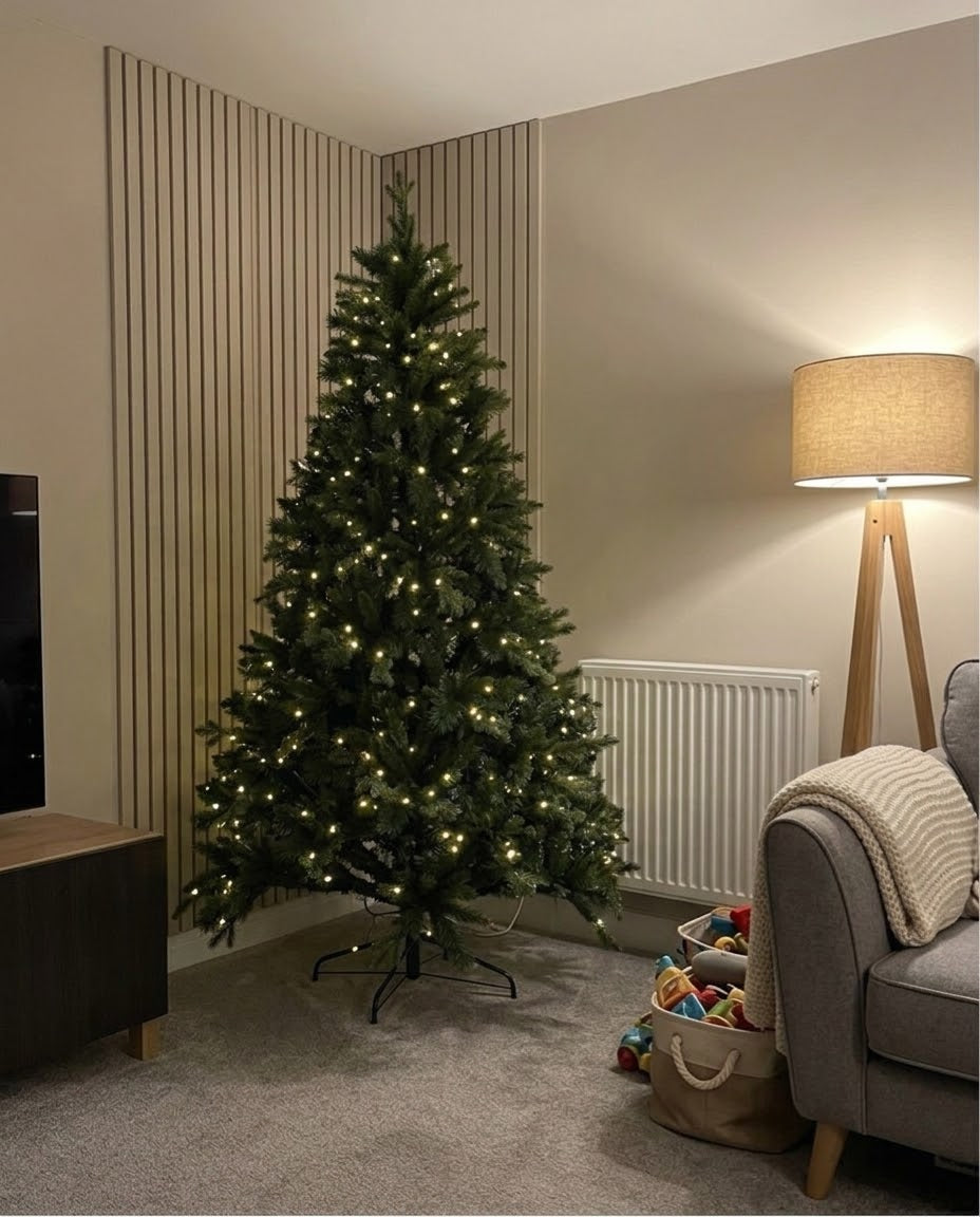 7ft pre-lit Forest Fir artificial Christmas tree in a modern living room with slat panelling