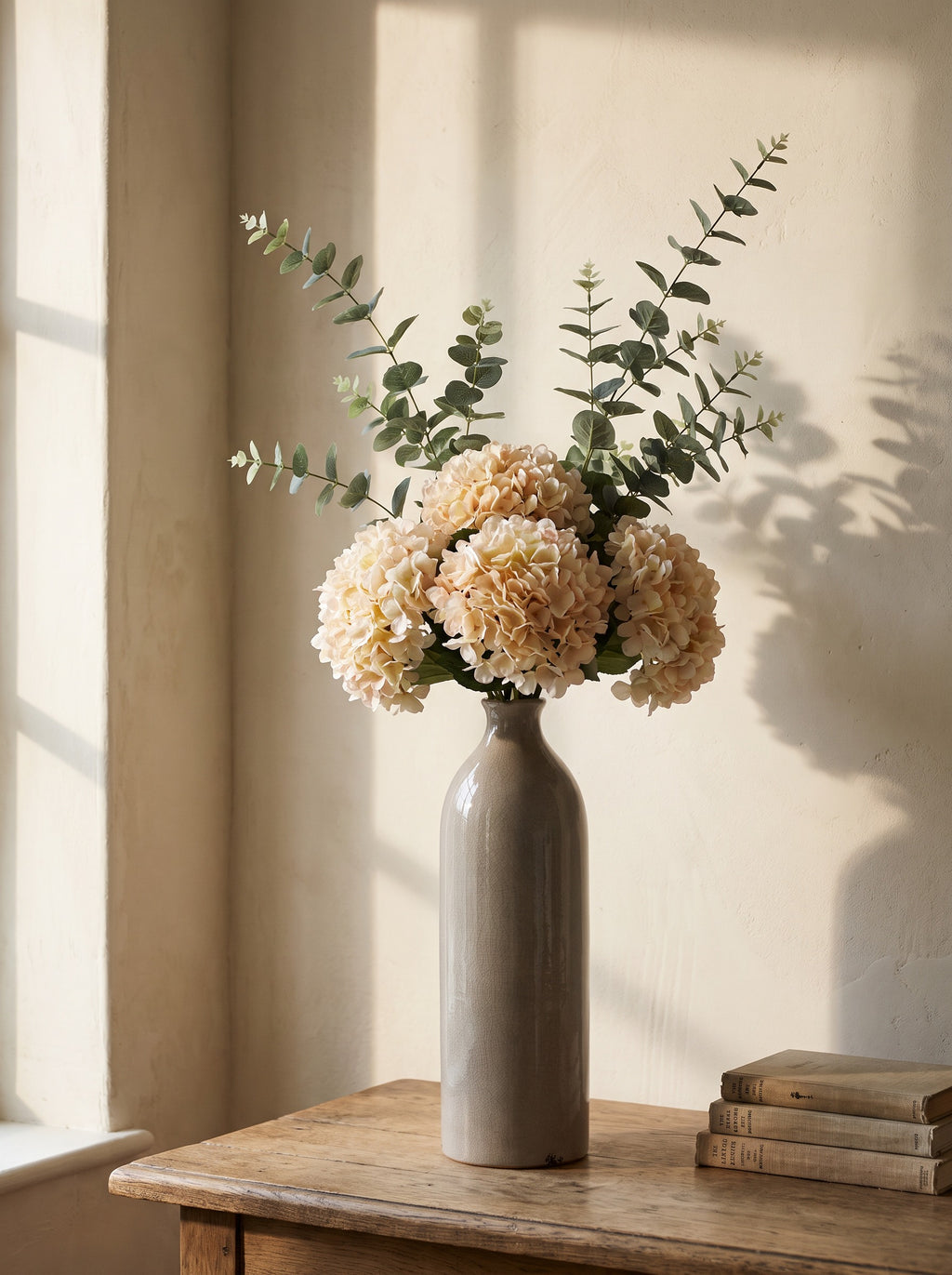 The Gisela White Arrangement — white hydrangeas and eucalyptus in the crackle-glazed Gisela vase
