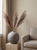 The Tiber Pampas Arrangement — taupe pampas plumes in the Tiber stone globe vase