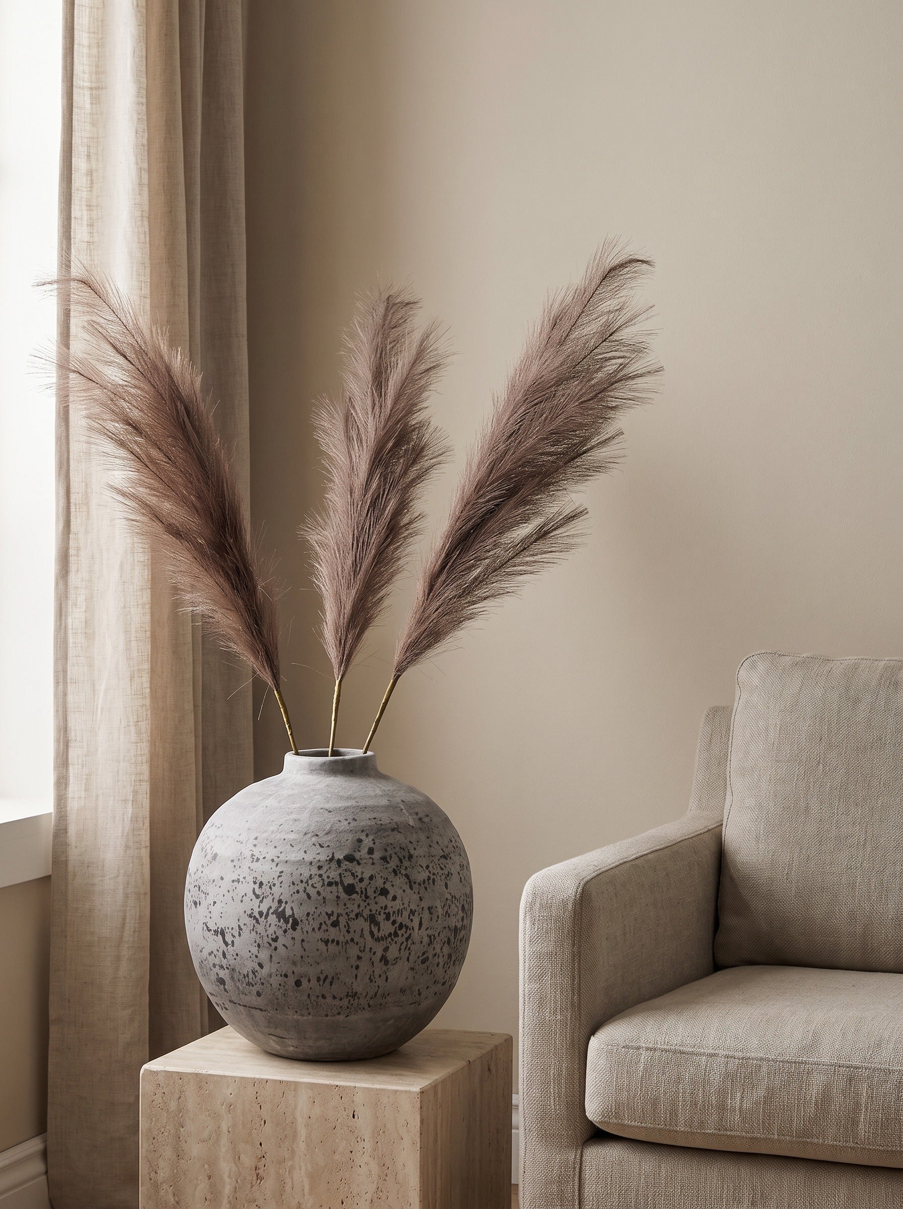 The Tiber Pampas Arrangement — taupe pampas plumes in the Tiber stone globe vase