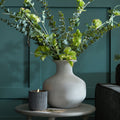 Darcy Squat Stone Vase styled with eucalyptus and ribbed candle